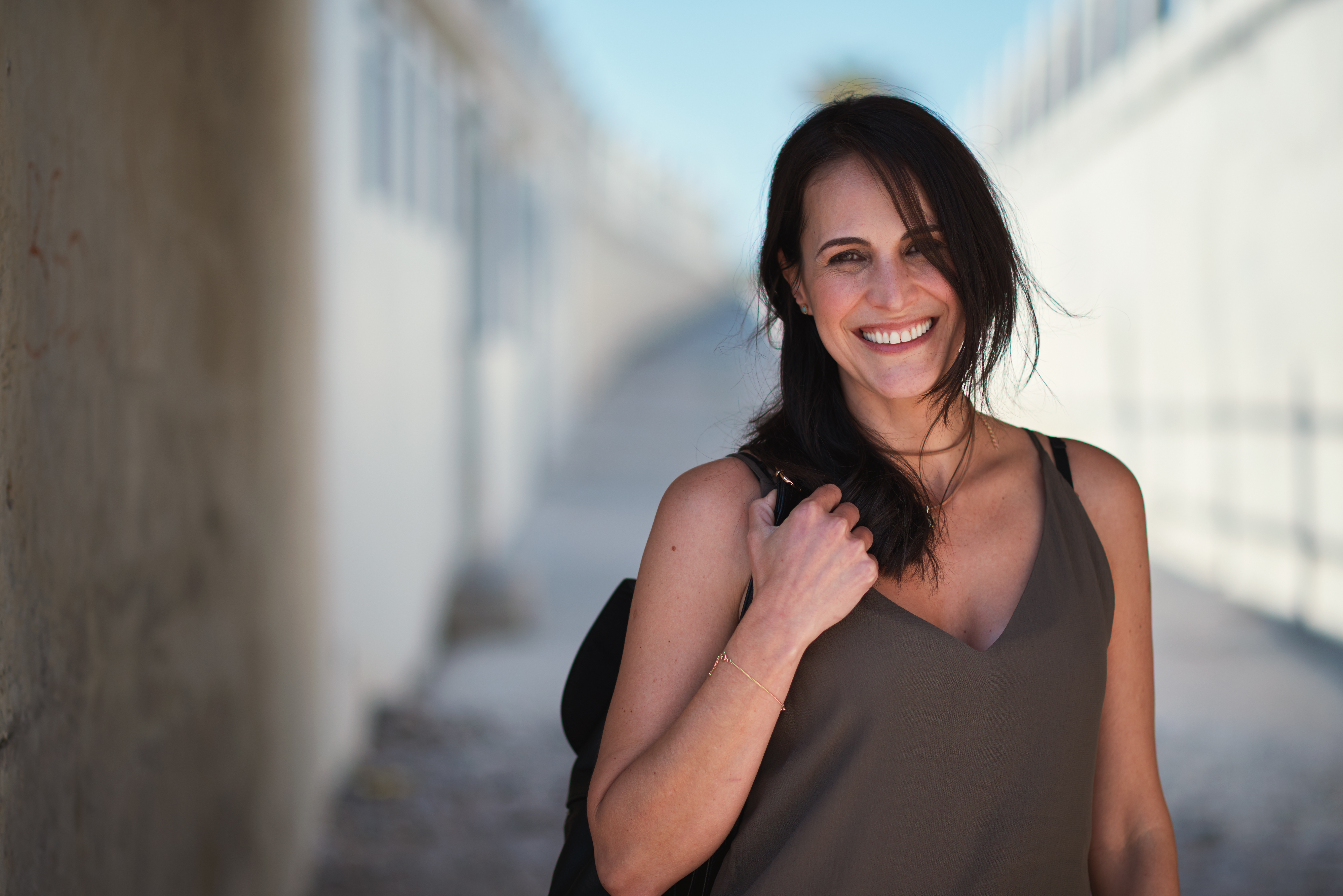 Happy travel woman smiling in city looking confident female tourist enjoying vacation testimonial